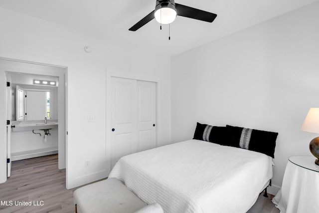 1302 Magnolia St Unit A101, Gulfport, MS 39507 - bedroom featuring a closet, wood finished floors, and ceiling fan