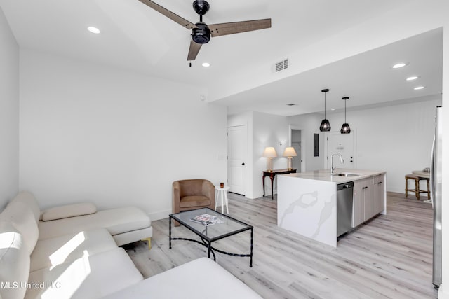 1302 Magnolia St Unit A101, Gulfport, MS 39507 - living area with light wood-style floors, ceiling fan, and recessed lighting
