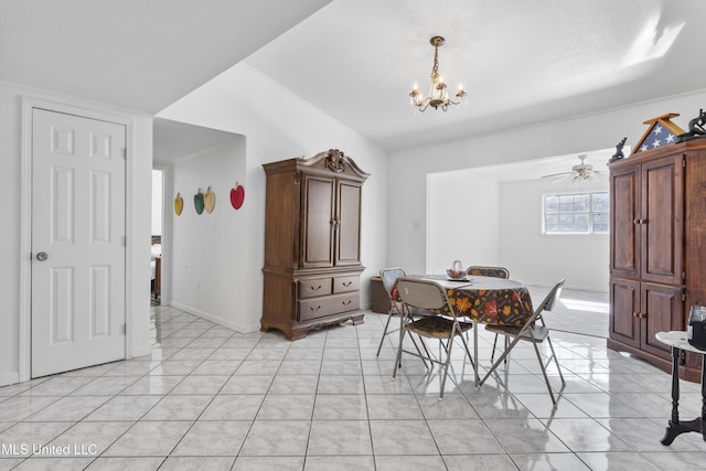 tiled dining space with ceiling fan with notable chandelier