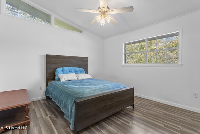 bedroom with lofted ceiling, ceiling fan, and dark hardwood / wood-style floors