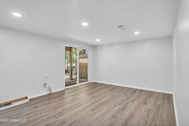unfurnished room featuring visible vents, recessed lighting, and wood finished floors