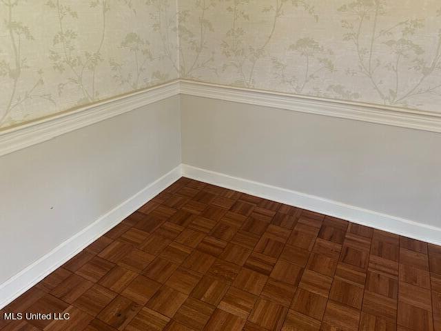 interior space featuring dark parquet floors