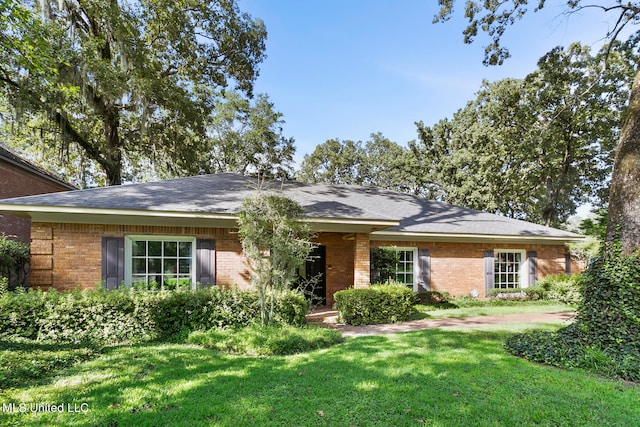 ranch-style house with a front lawn