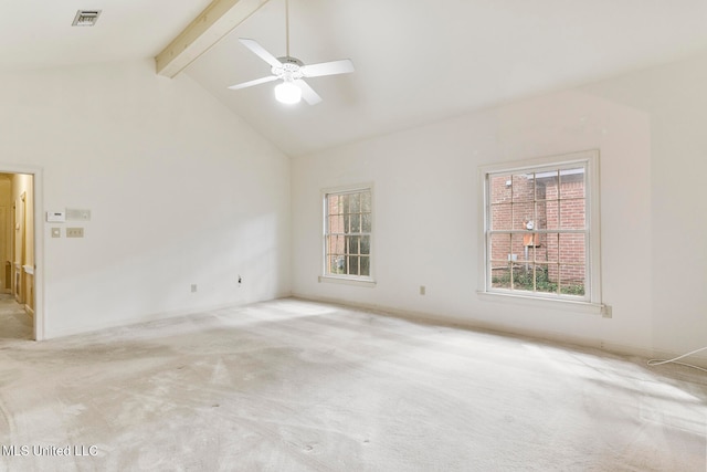 carpeted empty room with beamed ceiling, high vaulted ceiling, and ceiling fan