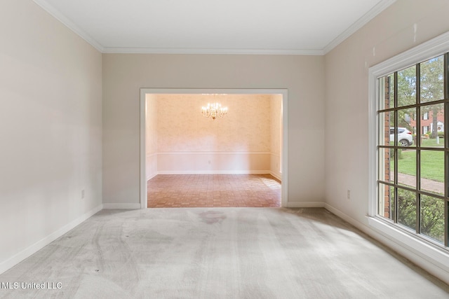 empty room featuring light carpet, crown molding, and a chandelier