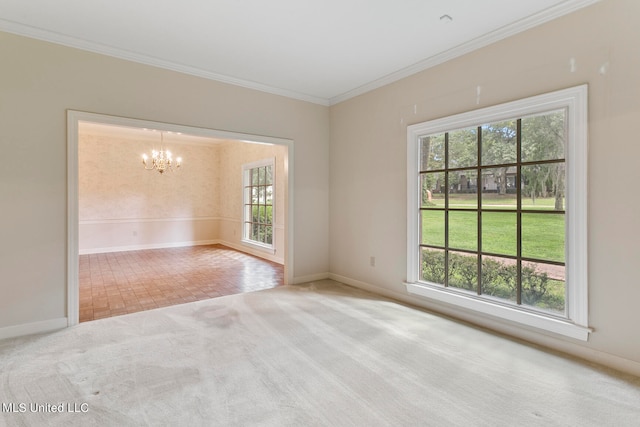 empty room featuring crown molding, a chandelier, and carpet flooring