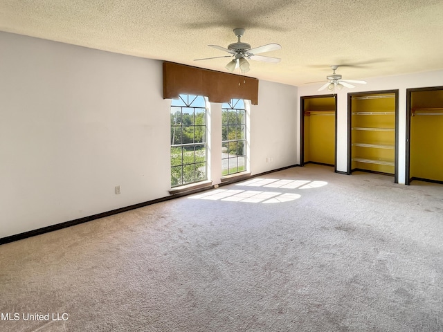 unfurnished bedroom featuring light colored carpet and a textured ceiling