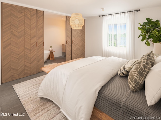 bedroom featuring tile patterned floors