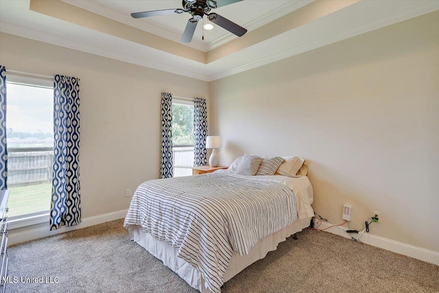 218 Greenfield Ridge Dr, Brandon, MS 39042 - carpeted bedroom featuring a raised ceiling, crown molding, baseboards, and a ceiling fan