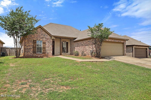 218 Greenfield Ridge Dr, Brandon, MS 39042 - view of front facade with brick siding, a garage, concrete driveway, a shingled roof, and central air condition unit