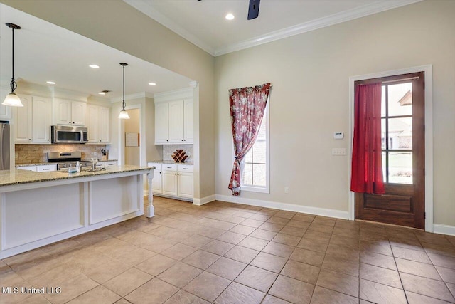 218 Greenfield Ridge Dr, Brandon, MS 39042 - kitchen with stainless steel appliances, backsplash, ornamental molding, white cabinetry, and light tile patterned floors