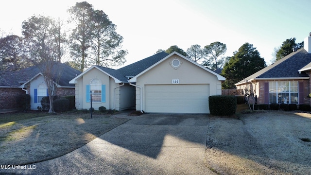 ranch-style home with a garage