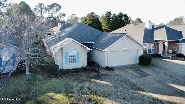 view of front facade with a garage and a front yard