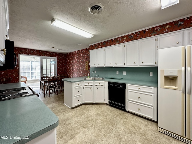 kitchen with pendant lighting, black appliances, kitchen peninsula, white cabinetry, and a textured ceiling