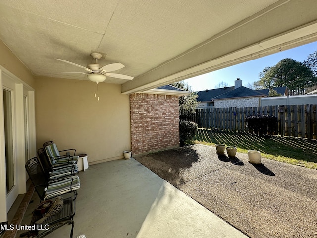 view of patio featuring ceiling fan