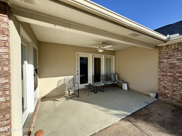 view of patio / terrace featuring ceiling fan