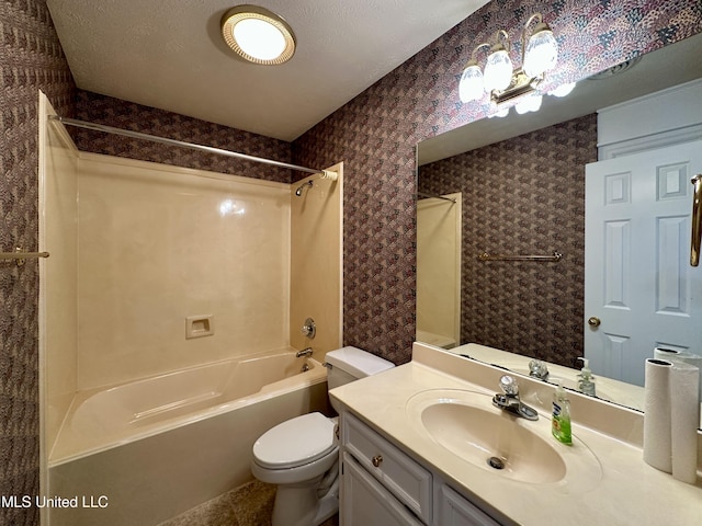 full bathroom featuring toilet, vanity, shower / tub combination, and a textured ceiling