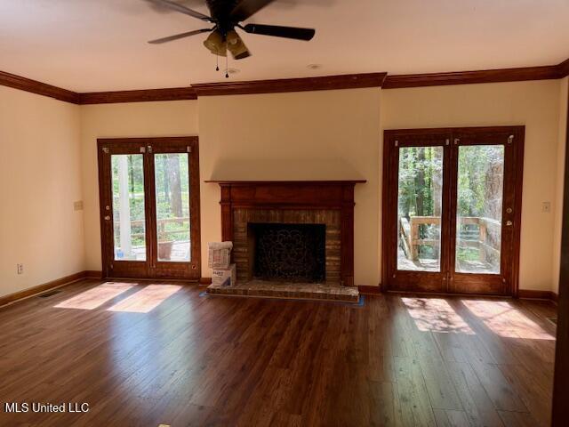 618 Gordon Pl Unit 618, Madison, MS 39110 - unfurnished living room featuring healthy amount of natural light, hardwood / wood-style floors, a ceiling fan, ornamental molding, and baseboards