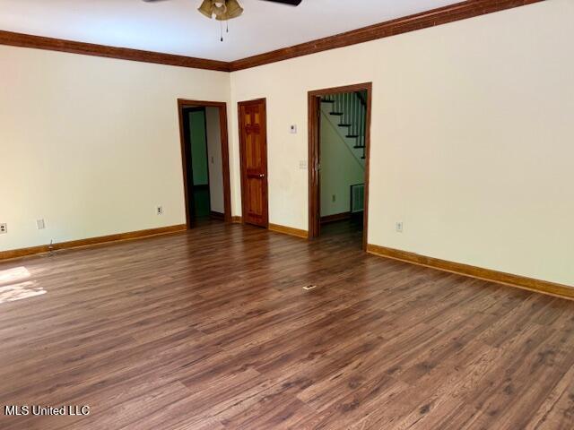 618 Gordon Pl Unit 618, Madison, MS 39110 - empty room featuring a ceiling fan, ornamental molding, dark wood-style floors, and baseboards