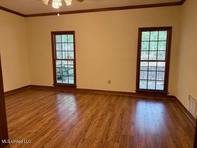 618 Gordon Pl Unit 618, Madison, MS 39110 - spare room featuring wood finished floors, crown molding, and baseboards