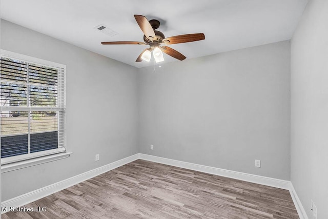 unfurnished room with ceiling fan and light hardwood / wood-style flooring