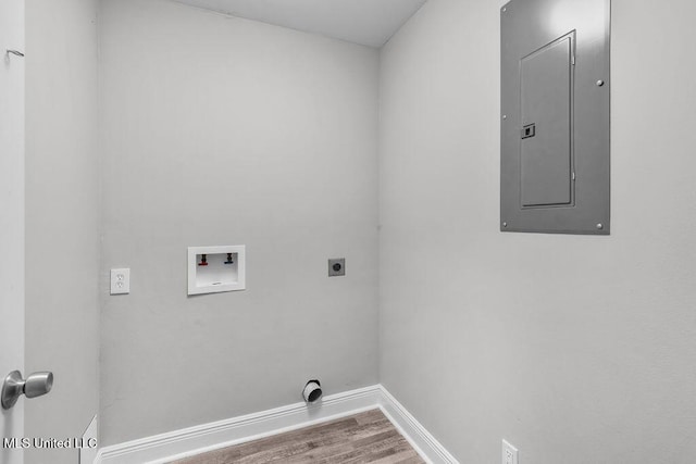 clothes washing area featuring hookup for an electric dryer, hardwood / wood-style floors, electric panel, and hookup for a washing machine