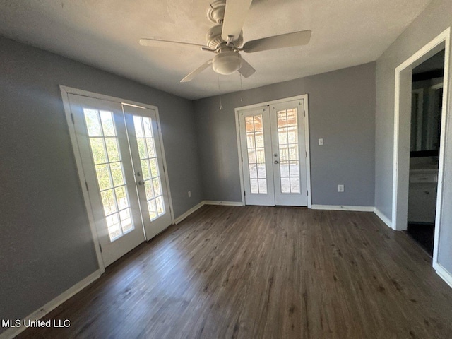 540 Woodland Hills Pl, Jackson, MS 39216 - spare room with a ceiling fan, plenty of natural light, french doors, and dark wood-style flooring