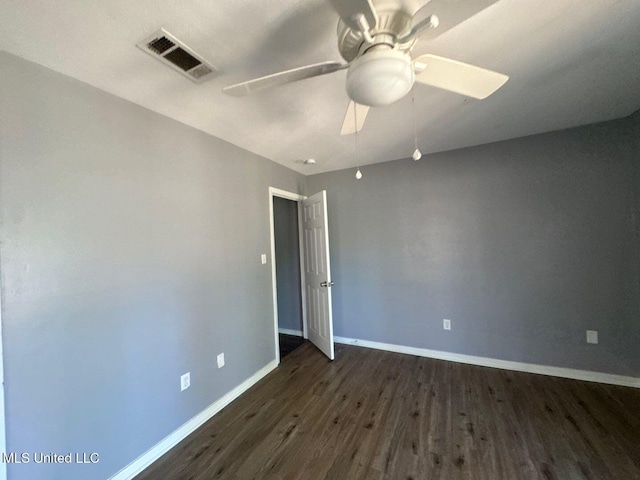 540 Woodland Hills Pl, Jackson, MS 39216 - spare room featuring dark wood-style floors, baseboards, visible vents, and ceiling fan
