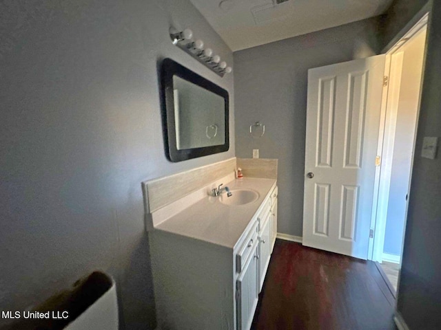 540 Woodland Hills Pl, Jackson, MS 39216 - bathroom featuring vanity, baseboards, and wood finished floors