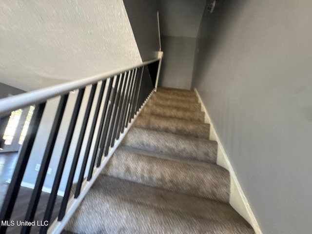 540 Woodland Hills Pl, Jackson, MS 39216 - staircase featuring baseboards and carpet flooring