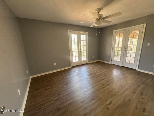 540 Woodland Hills Pl, Jackson, MS 39216 - empty room with dark wood-style floors, french doors, baseboards, and ceiling fan