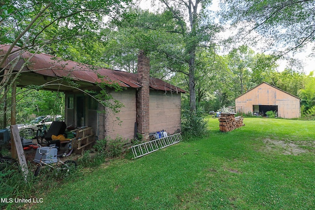 2548 Furrs Mill Dr, Wesson, MS 39191 - view of grassy yard with an outbuilding and a detached garage