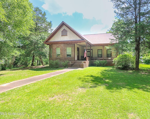 2548 Furrs Mill Dr, Wesson, MS 39191 - view of front of home featuring covered porch, brick siding, and a front lawn