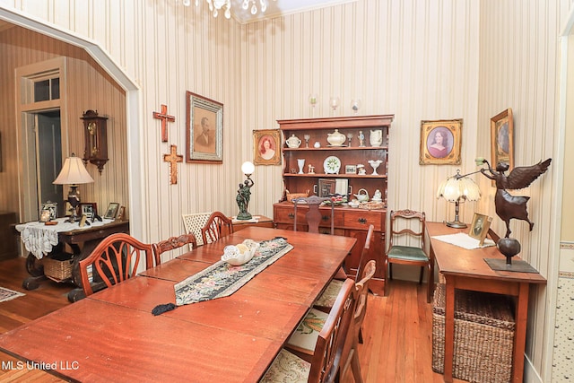 2548 Furrs Mill Dr, Wesson, MS 39191 - dining space featuring wood finished floors, a chandelier, and wallpapered walls