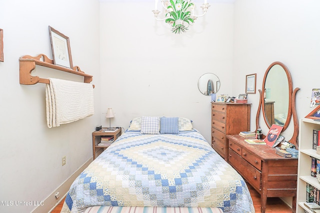 2548 Furrs Mill Dr, Wesson, MS 39191 - bedroom featuring wood finished floors, baseboards, and a chandelier