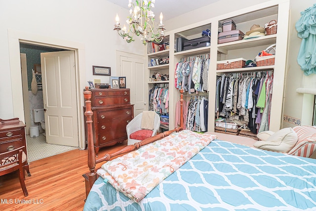 2548 Furrs Mill Dr, Wesson, MS 39191 - bedroom featuring wood finished floors, a chandelier, and a closet