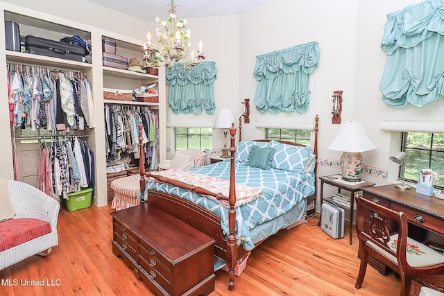 2548 Furrs Mill Dr, Wesson, MS 39191 - bedroom with a closet, hardwood / wood-style floors, and a chandelier