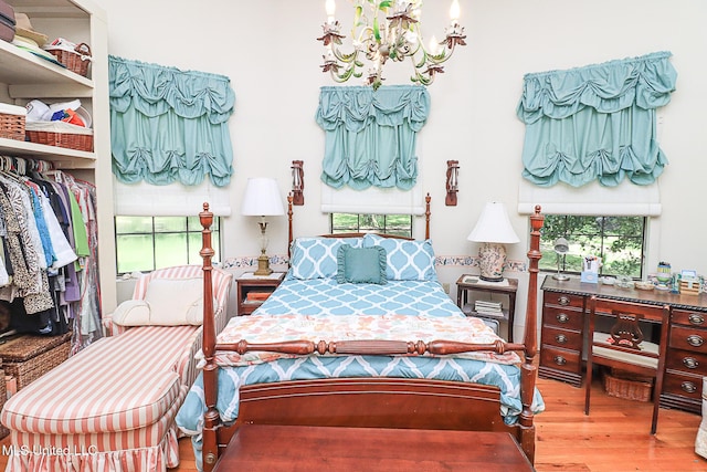 2548 Furrs Mill Dr, Wesson, MS 39191 - bedroom with a chandelier, wood finished floors, and a closet