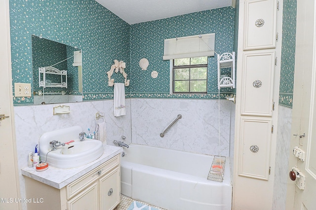 2548 Furrs Mill Dr, Wesson, MS 39191 - bathroom with vanity, a bath, and wallpapered walls
