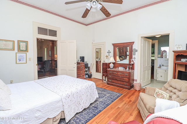 2548 Furrs Mill Dr, Wesson, MS 39191 - bedroom with wood finished floors, crown molding, a high ceiling, connected bathroom, and ceiling fan