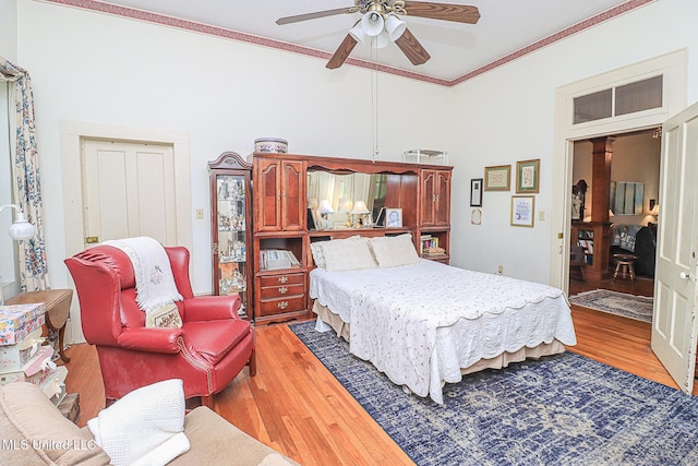 2548 Furrs Mill Dr, Wesson, MS 39191 - bedroom with light wood finished floors, crown molding, a towering ceiling, and a ceiling fan