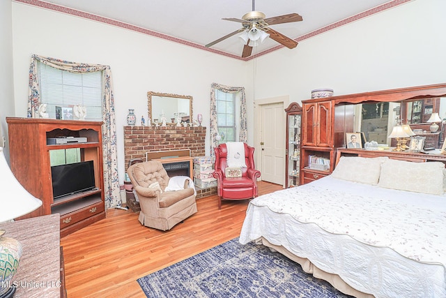 2548 Furrs Mill Dr, Wesson, MS 39191 - bedroom featuring crown molding, wood finished floors, a fireplace, and ceiling fan