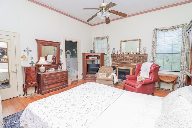 2548 Furrs Mill Dr, Wesson, MS 39191 - bedroom with ornamental molding, wood finished floors, a fireplace, a ceiling fan, and ensuite bath