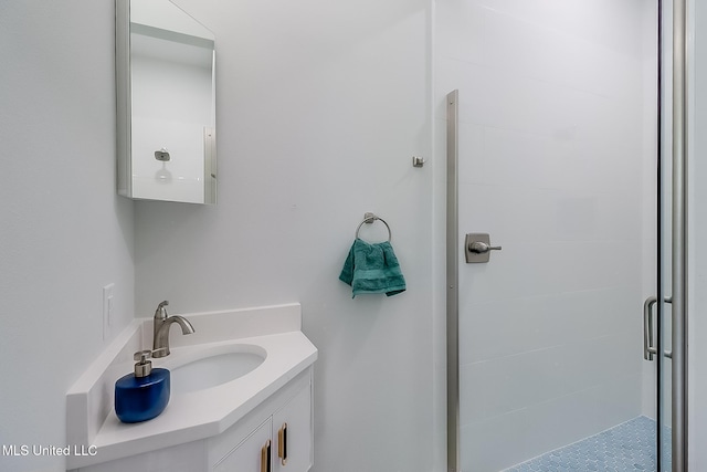 bathroom with vanity and an enclosed shower