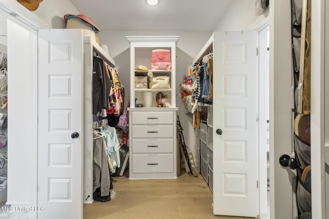 walk in closet featuring light wood-type flooring