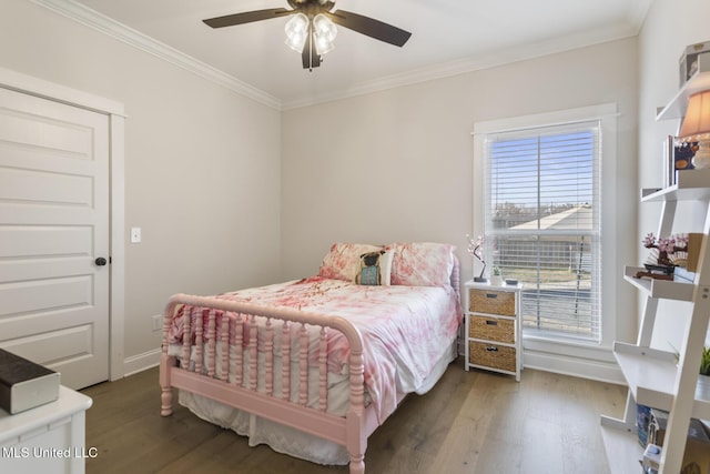 bedroom featuring ceiling fan, dark hardwood / wood-style flooring, and ornamental molding