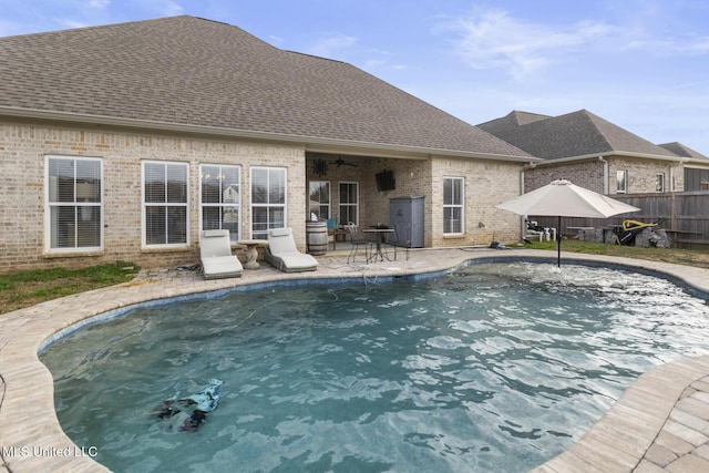 view of pool featuring ceiling fan and a patio area