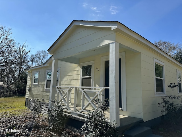 view of property exterior with covered porch