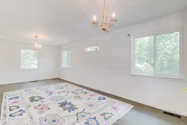 2512 Randall Dr, Biloxi, MS 39531 - empty room featuring a chandelier and wood finished floors