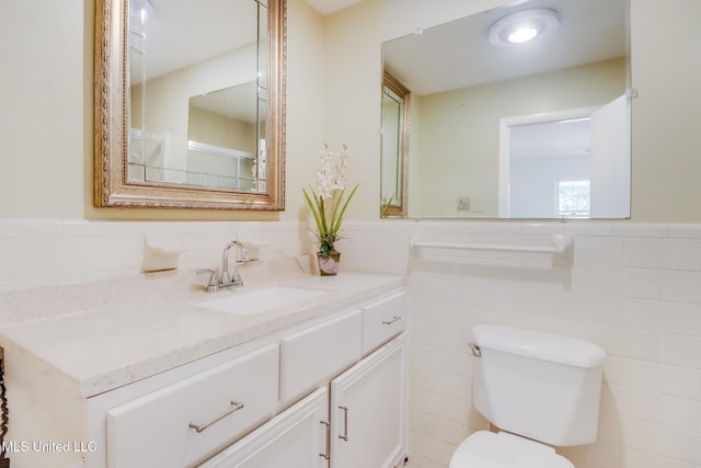 2512 Randall Dr, Biloxi, MS 39531 - bathroom with tile walls, vanity, and a wainscoted wall